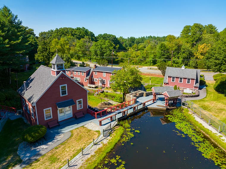 Russell Mill aerial view on River Meadow Brook in Russell Millpond in town of Chelmsford, Massachusetts MA on a clear sunny day.